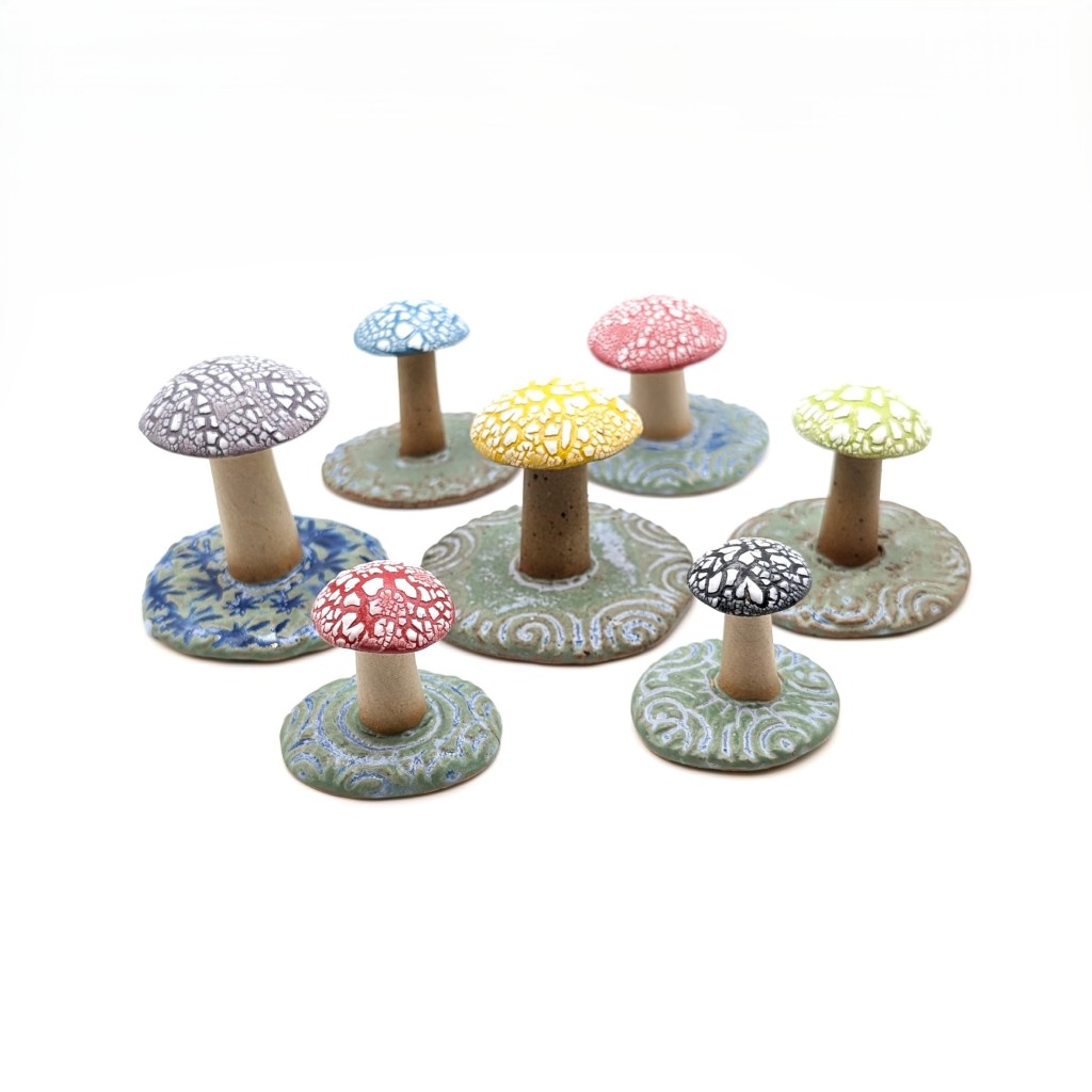 Colourful handmade ceramic pottery toadstool ornaments with special effect glaze
